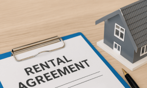 Rental agreement form on clipboard with pen and house model, representing landlord-tenant services in Hanford, Visalia, and Lemoore.