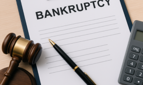 Bankruptcy form on clipboard with pen, gavel, and calculator, symbolizing financial document support in Hanford, Visalia, and Lemoore.